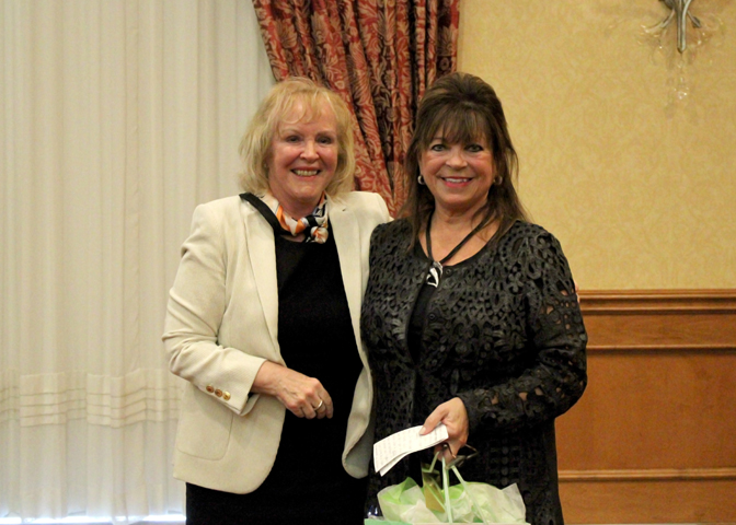 Photo: Tammy Stevenson (right) receiving her award from President and CEO, Jo-Anne Poirier